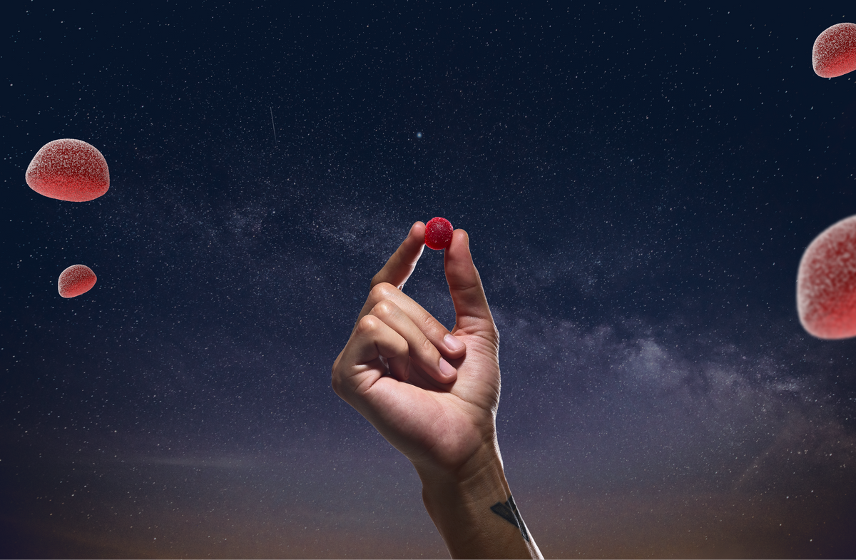 THC gummy dosage: a hand holding a single Willie's 10mg THC gummy